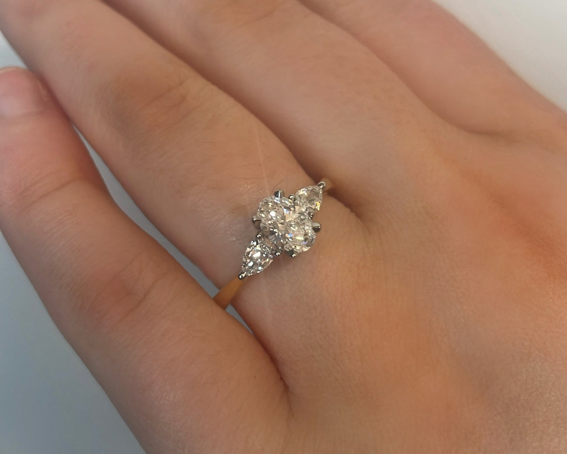 0.72ct Oval with pear cut side stones in 18ct yellow gold