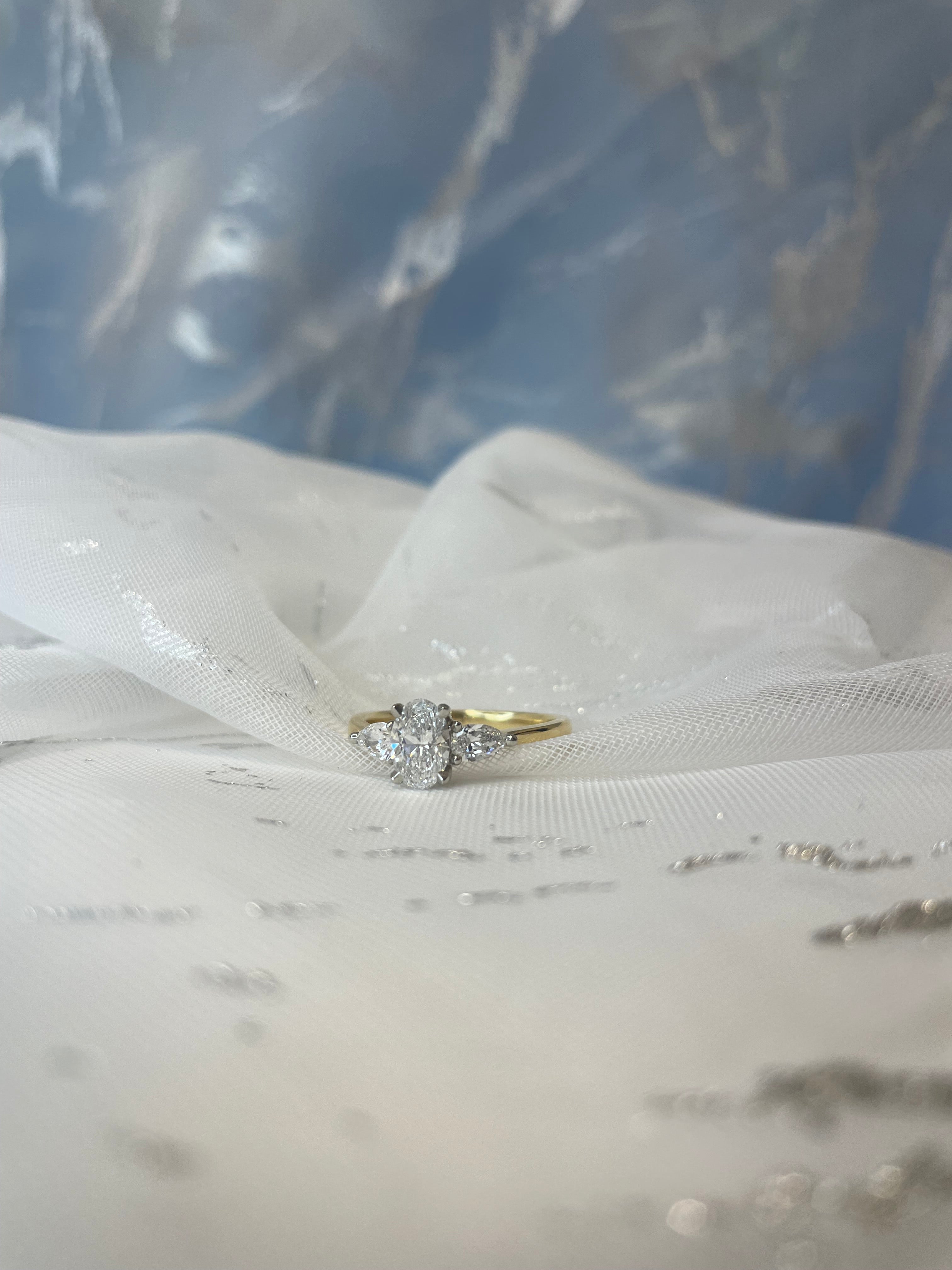 0.72ct Oval with pear cut side stones in 18ct yellow gold