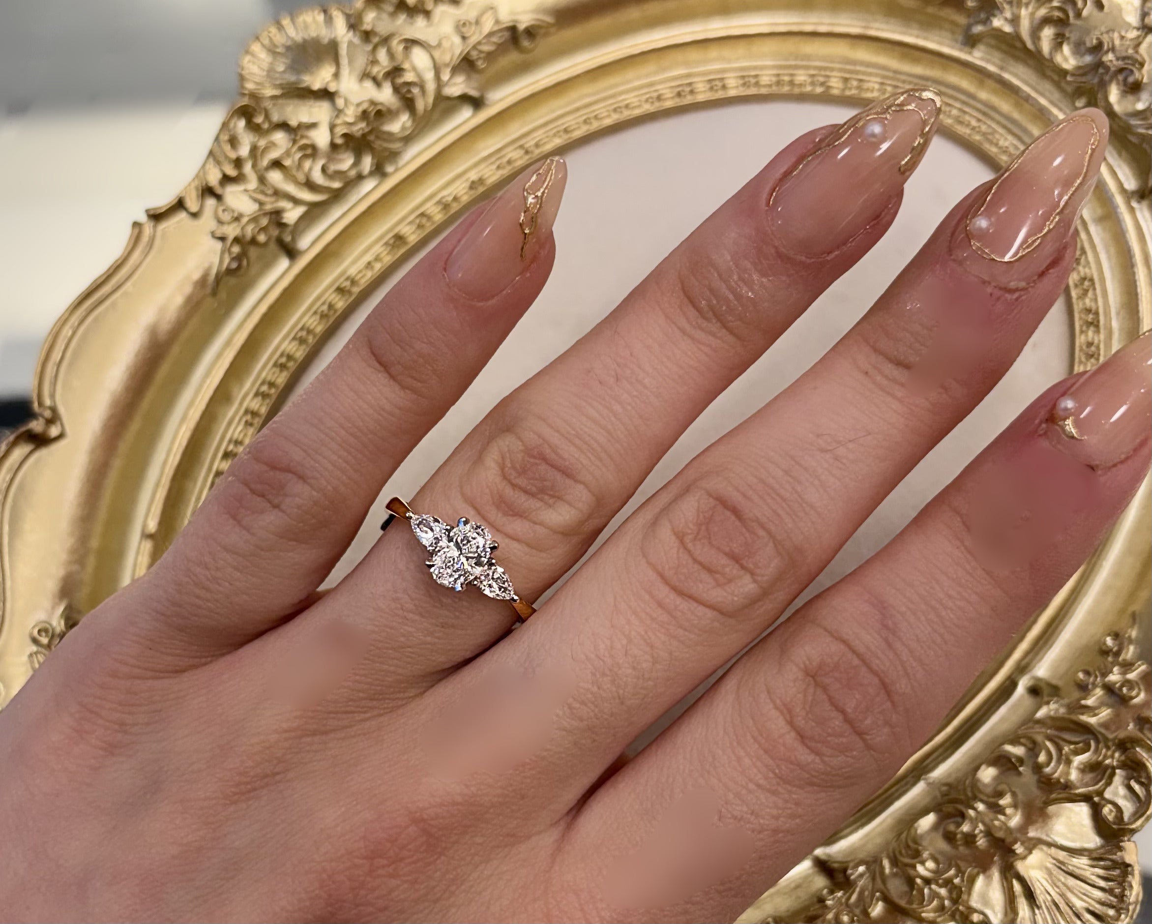 0.72ct Oval with pear cut side stones in 18ct yellow gold