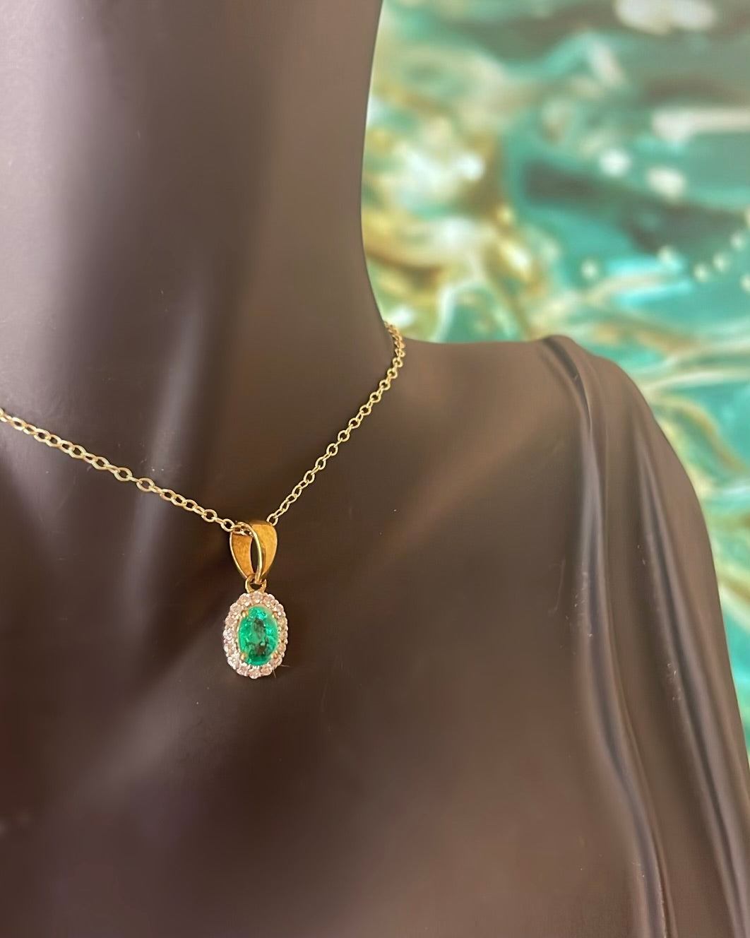 Oval Cut Emerald & Halo Diamond 9ct Yellow Gold Pendant