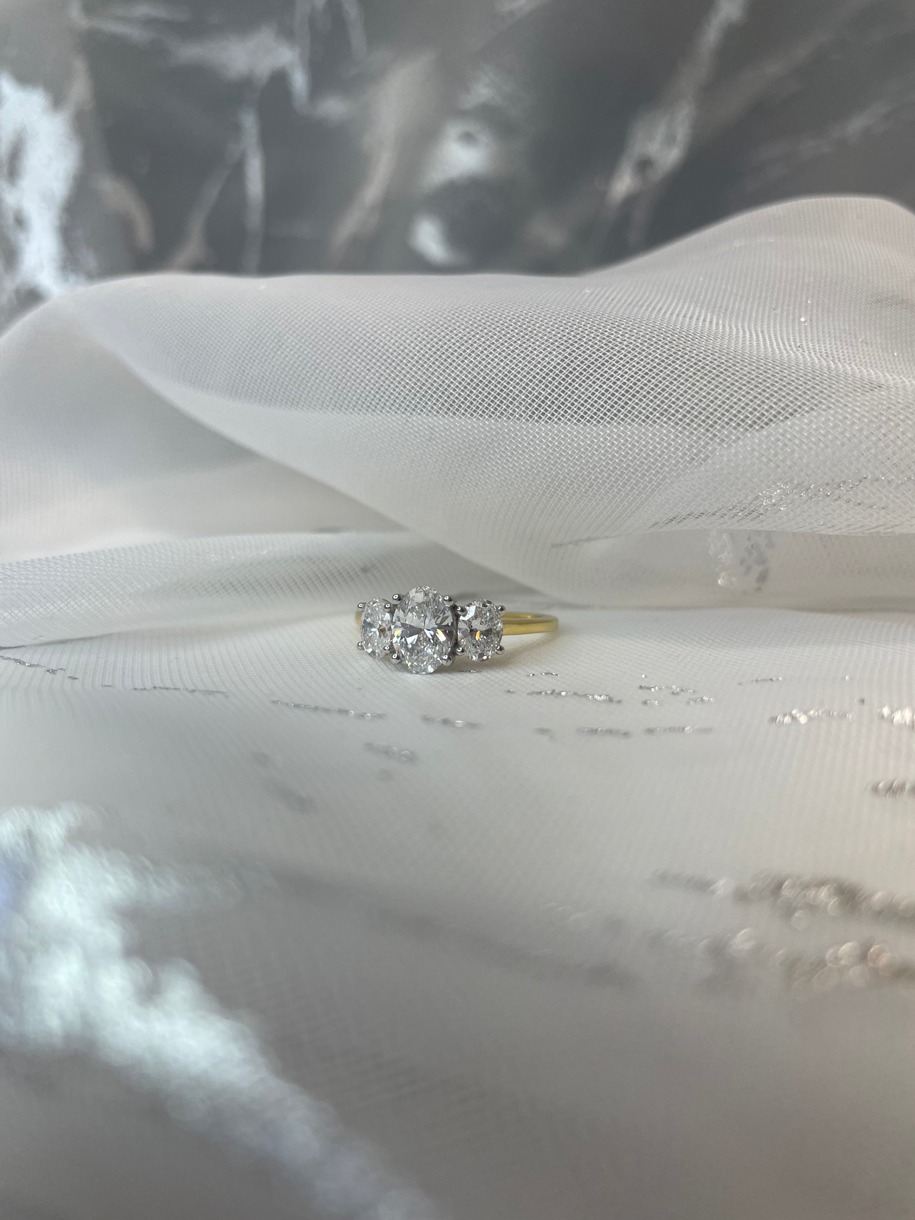 1.54ct Oval trilogy ring in 18ct yellow gold