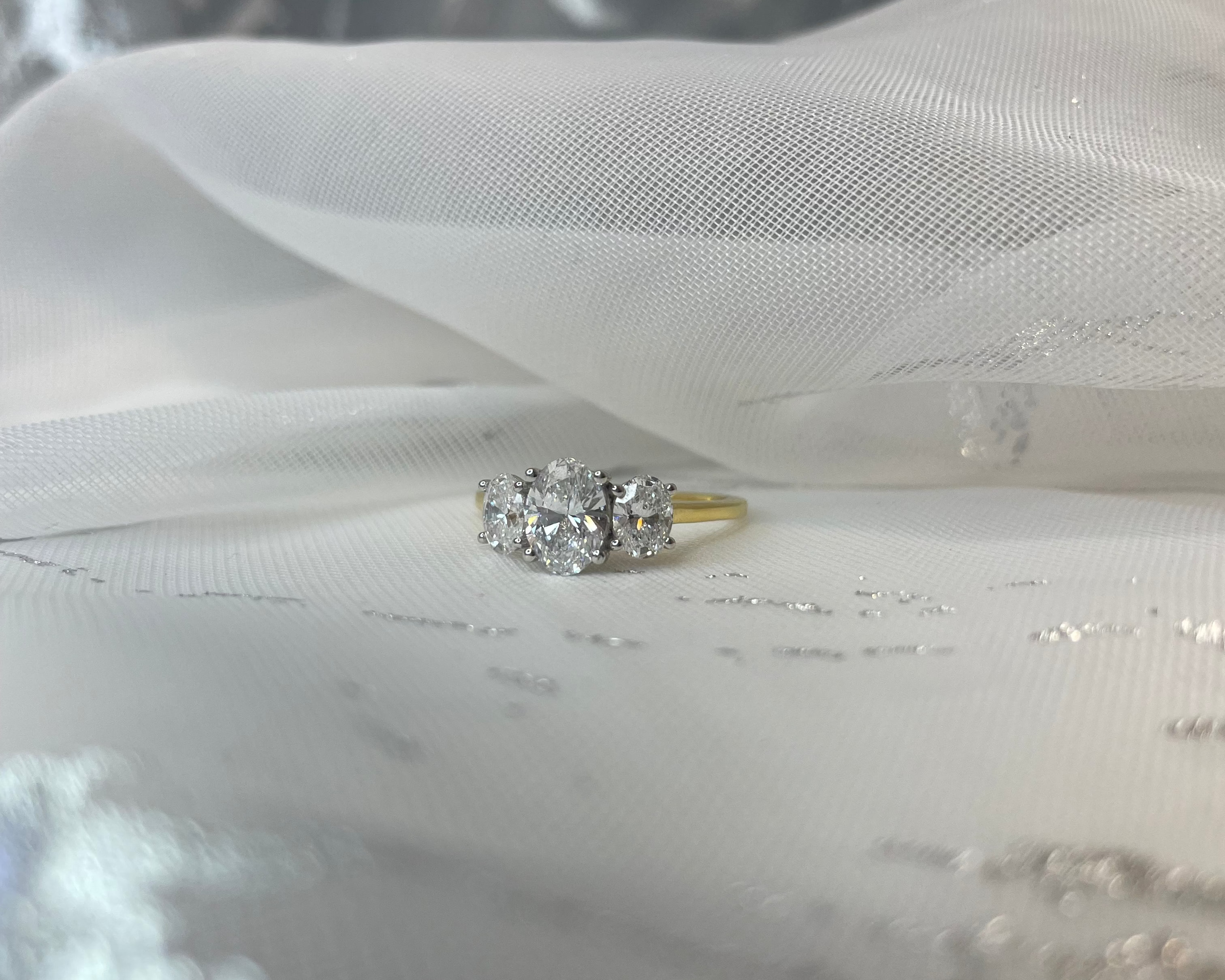 1.54ct Oval trilogy ring in 18ct yellow gold