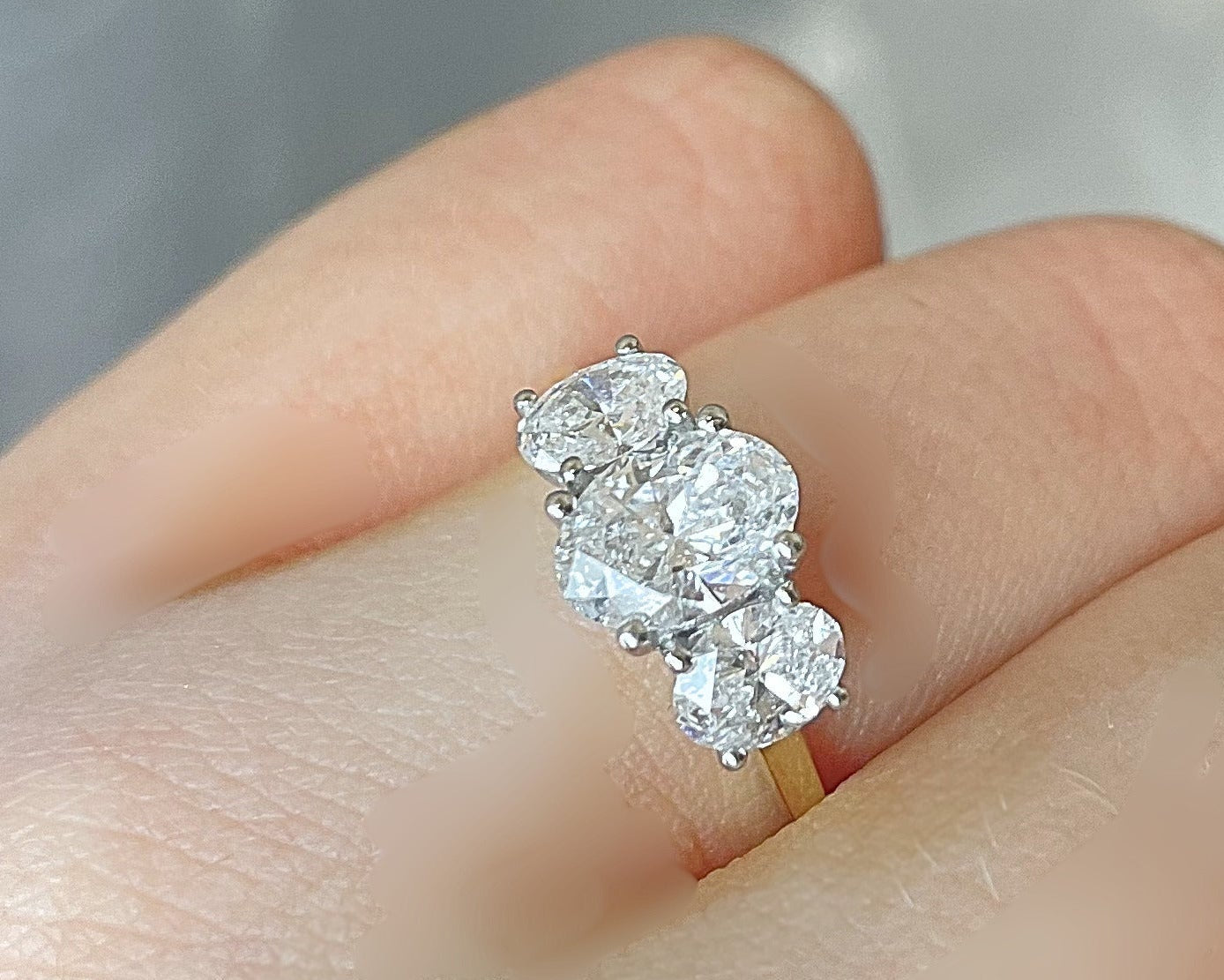 1.54ct Oval trilogy ring in 18ct yellow gold