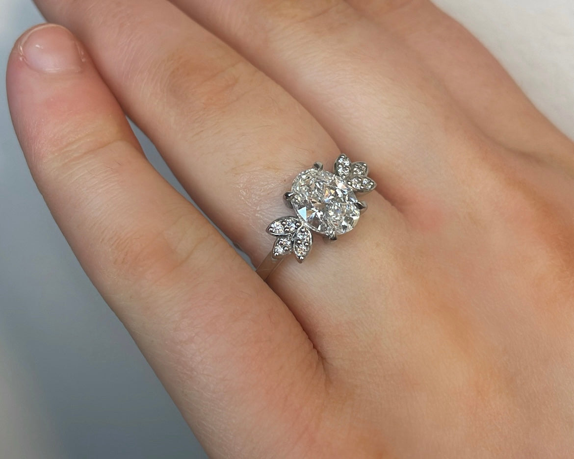 1.5ct Oval Diamond & Petal Side Stones in Platinum