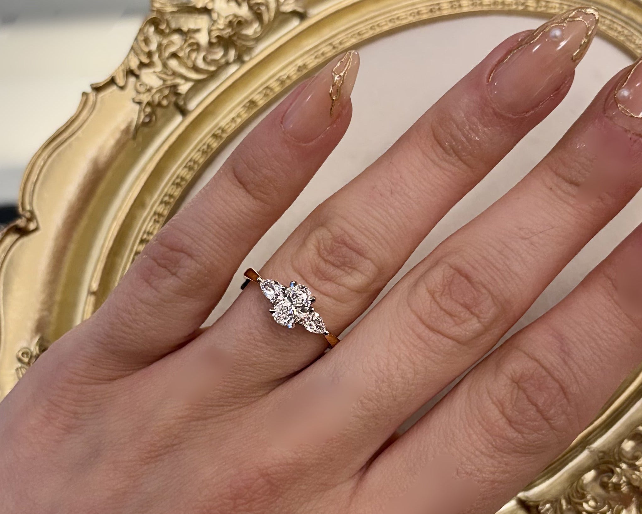 0.72ct Oval with pear cut side stones in 18ct yellow gold