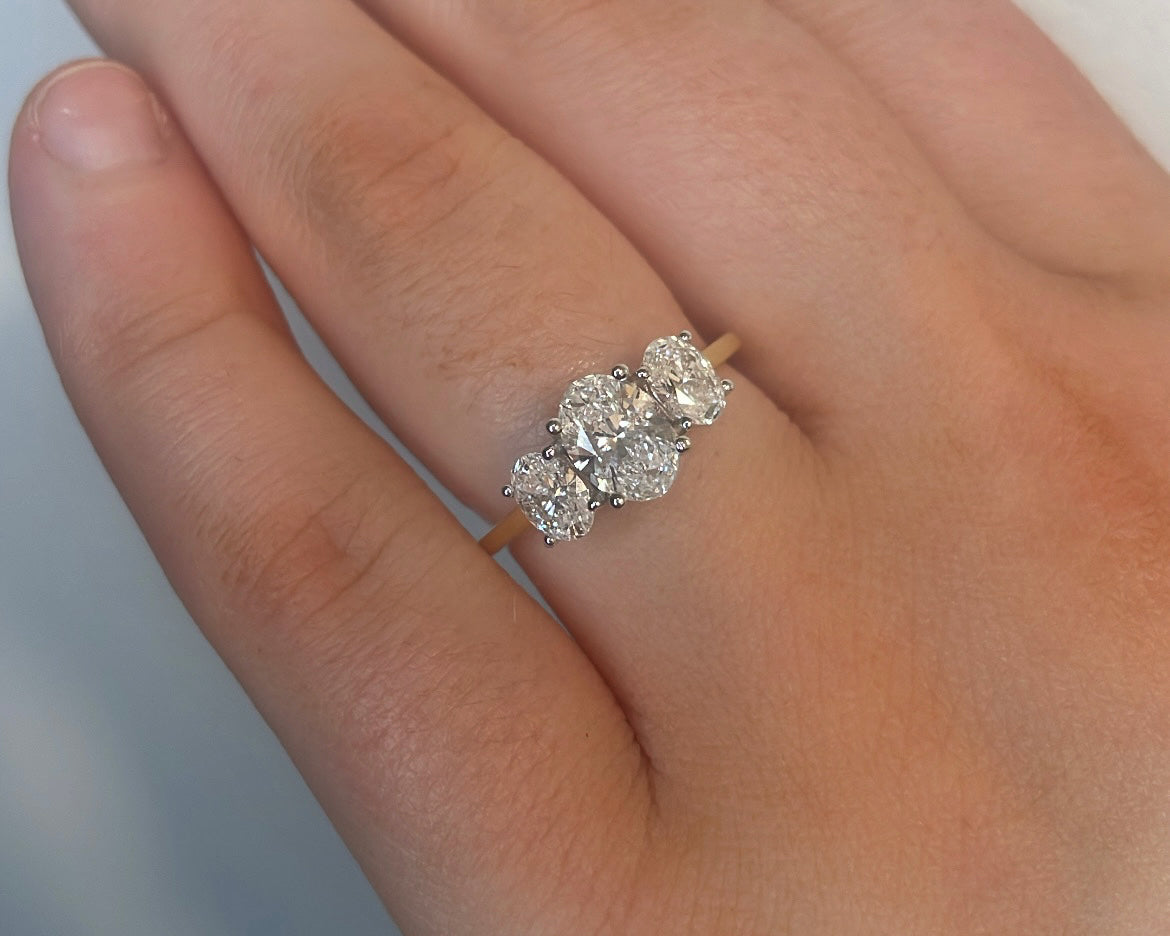 1.54ct Oval trilogy ring in 18ct yellow gold