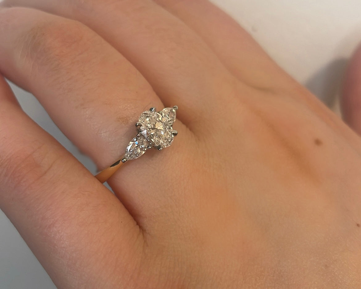 0.72ct Oval with pear cut side stones in 18ct yellow gold