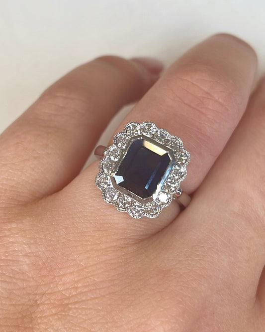 18ct Emerald Cut Sapphire with Vintage Diamond Halo Ring