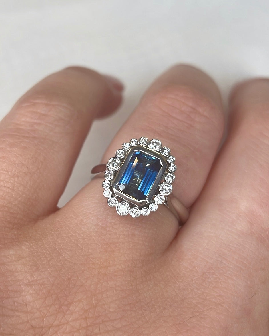 18ct Emerald Cut Sapphire and Diamond Halo Ring